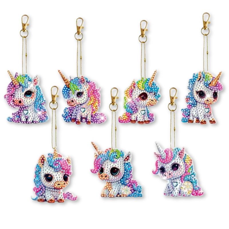 Sieben süße Diamond Painting Schlüsselanhänger mit bunten Einhorn-Motiven und glitzernden Steinchen zum Selbermachen