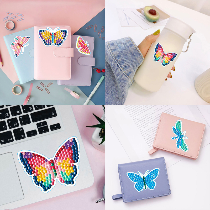 Diamond Painting Sticker Set mit bunten Schmetterlingen auf Notizbüchern, Trinkflaschen und Laptops dekoriert