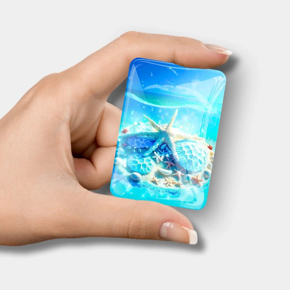 Glas Cover Minder Blaue Meeressymphonie als praktisches Zubehör für Diamond Painting mit Seestern-Motiv in Hand