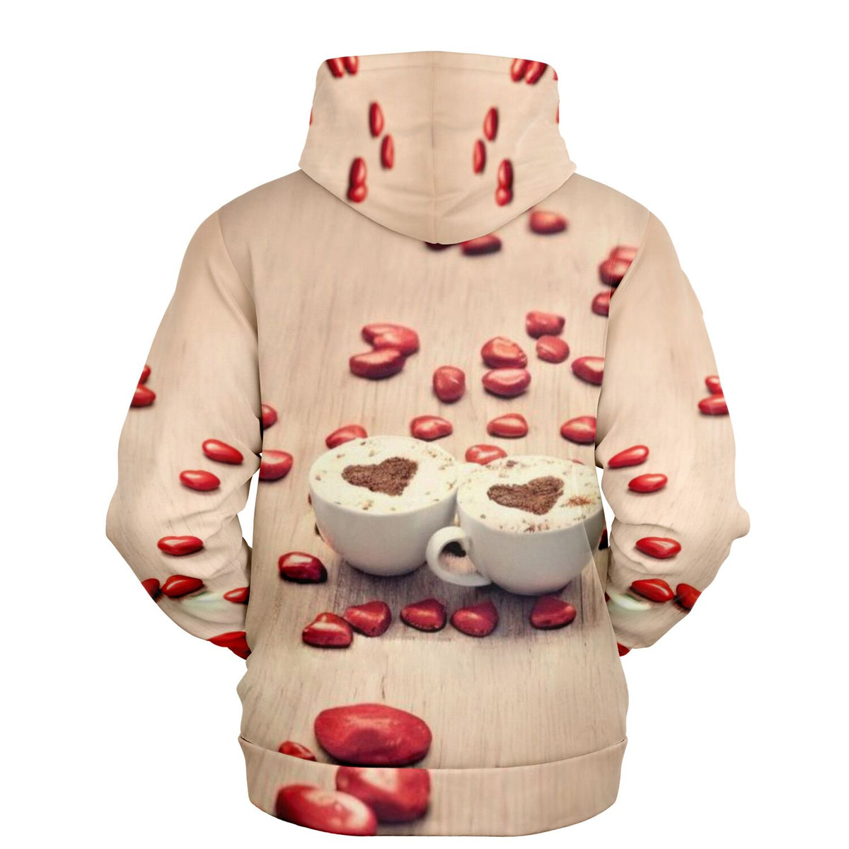 Dreamer Hoodie Kaffeeliebe mit Herz-Milchschaum-Motiv und roten Deko-Herzen auf hellem Hintergrund