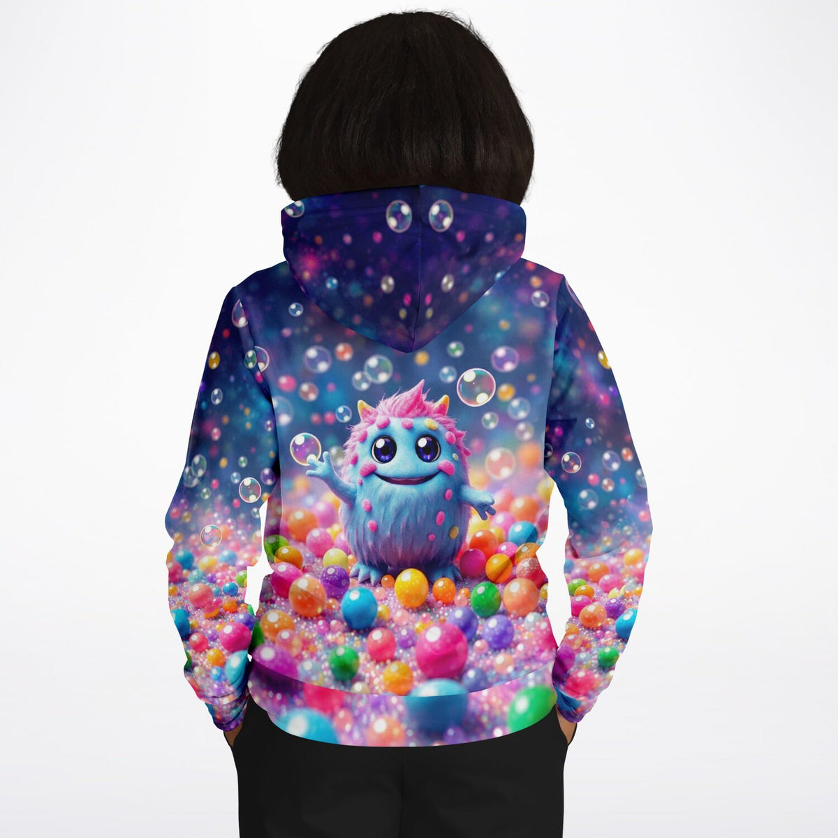 Dreamer Hoodie mit buntem Muffti-Monster-Design, umgeben von schwebenden Seifenblasen und farbenfrohen Kugeln