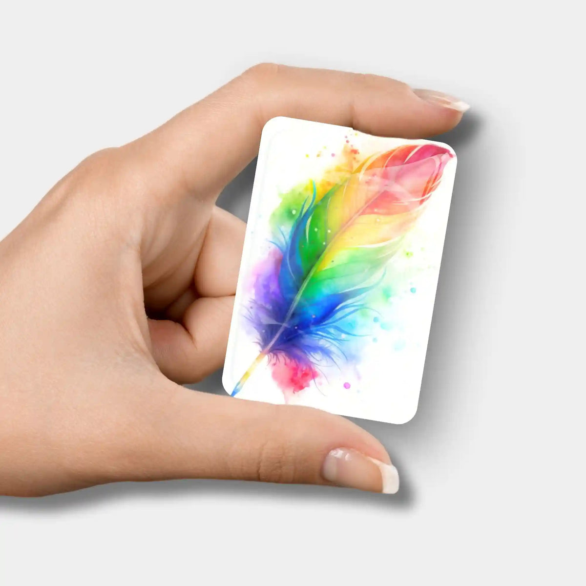 Bunter Regenbogen-Feder Cover Minder aus Glas zur Fixierung der Schutzfolie bei deinem Diamond Painting Projekt.