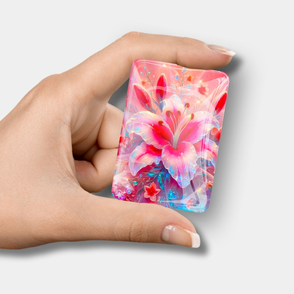 Rosa Cover Minder mit Lilien-Motiv aus Glas als praktisches Zubehör für Diamond Painting Projekte.