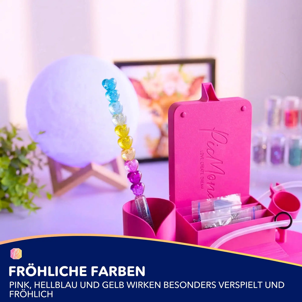 Glitzernder Diamond Painting Stift mit bunten Herzen als Zubehör für kreative DIY-Projekte in pinker Aufbewahrungsbox