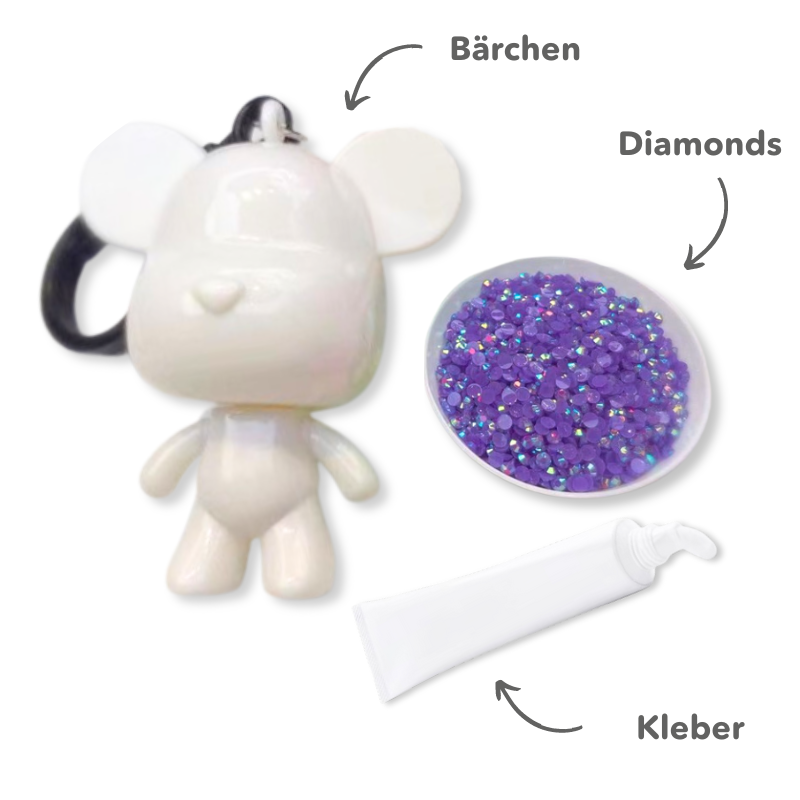 Diamond Painting Schlüsselanhänger als weißes Bärchen mit lila Glitzer-Steinchen und Kleber zum Basteln