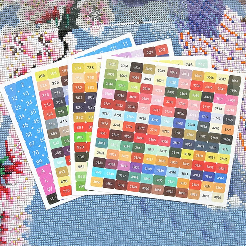 Bunte DMC Sticker Etiketten zur Organisation von Diamond Painting Steinchen auf einer Leinwand